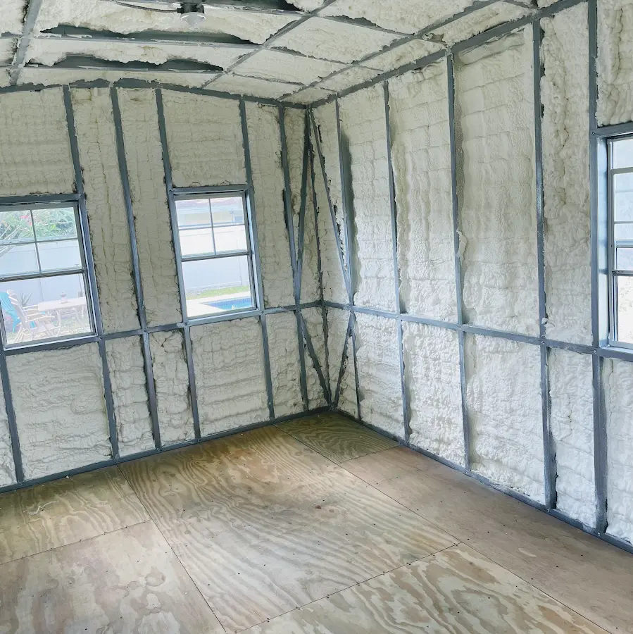 Closed-cell spray foam insulation applied to wall cavities in a residential project in Mayfield